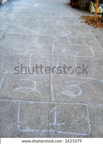 a hopscotch game for children to play drawn out on the concrete sidewalk