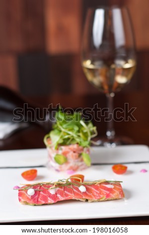 smoked salmon in two different ways on a white dish