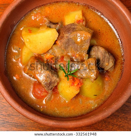 beef stew over a wooden board
