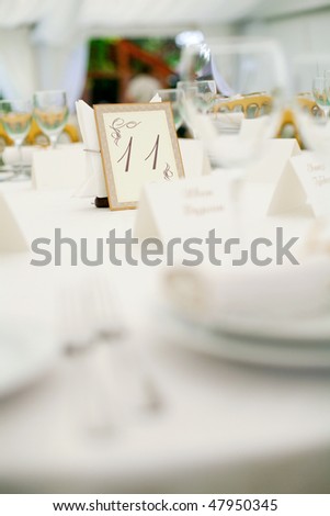 stock photo Elegant tables and chairs set up for a wedding banquet