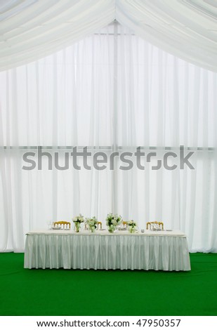 stock photo Elegant tables and chairs set up for a wedding banquet