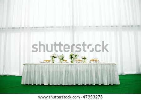Elegant tables and chairs set up for a wedding banquet