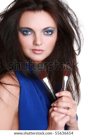 stock photo : Portrait of the beautiful young woman in a dark blue dress 