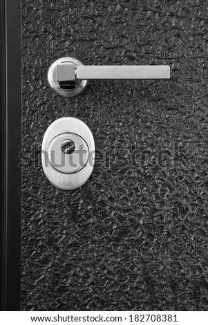 black front door with lock and handle