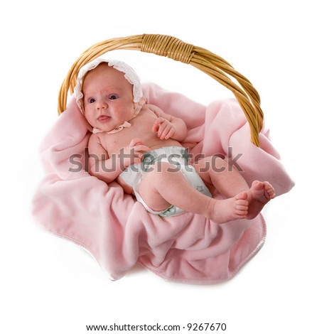stock photo A beautiful baby girl with cute facial expression lying in a 
