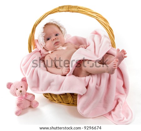 stock photo A beautiful baby girl with cute facial expression lying in a 