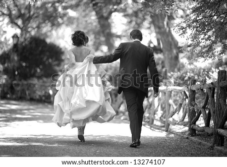 stock photo wedding bride and groom walking in the park