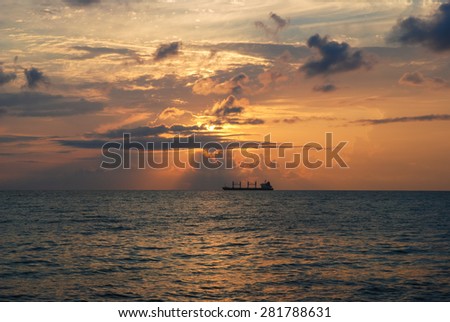 Sunset on sea, ship at sea.