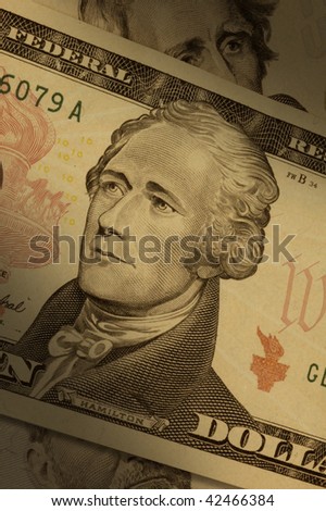 Close-up of a ten-dollar bill ($10), highlighting Alexander Hamilton.