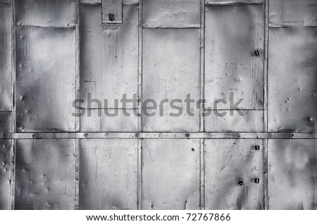 Metal panels on industrial door or wall
