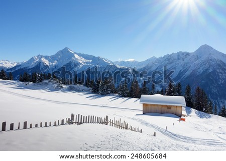Ski lodge and cottage in the snowy Alps
