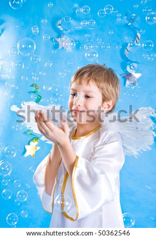 Little child in a fairy costume with angel wings