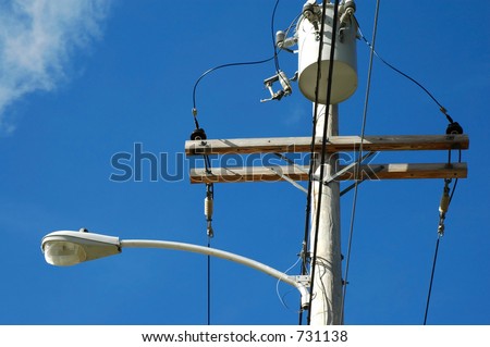 Telephone pole with street light
