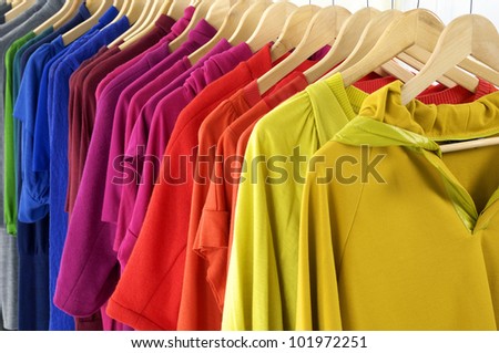 Fashion striped Shirt clothing hanging on hangers