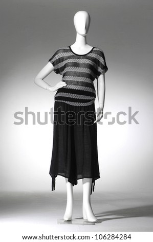 full-length woman cloth on mannequin on light background