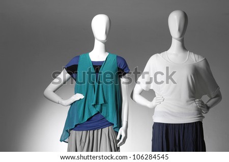 collection of dress in a hat on female mannequin in light background