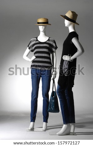 Full female clothing in jeans with bag on two mannequin