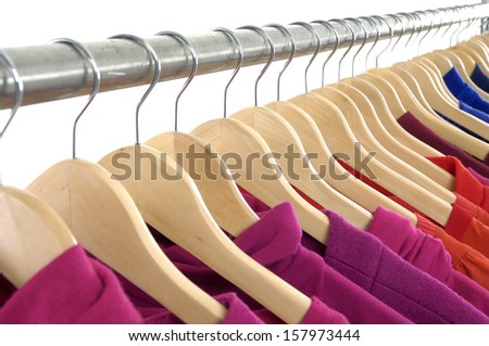 Set of Fashion female red and blue clothing hanging on hangers