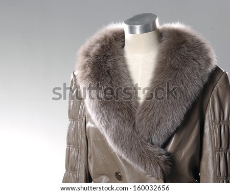 Isolated female fur coat dress on mannequin
