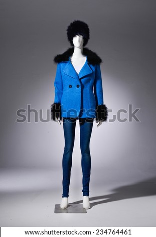 Full female blue cost clothing in jeans with hat on mannequin on light background