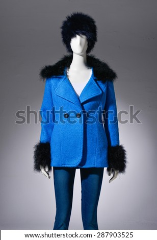 female blue cost clothing in jeans with hat on mannequin on light background