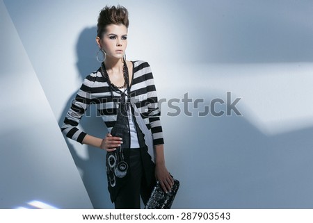 fashion or casual woman portrait holding purse posing