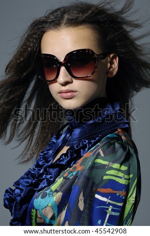 Close up fashion model wearing the big modern sunglasses.