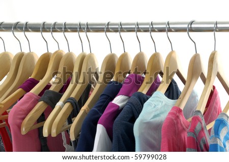 colorful shirt rack in line on white
