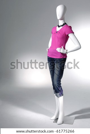 full-length collection of dress on mannequin in light background
