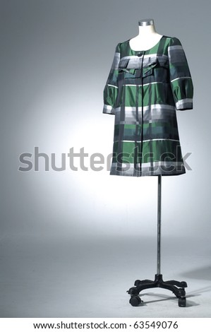 full-length fashion cloth on a dummy in light background