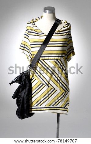 Fashion clothes on a mannequin with bag