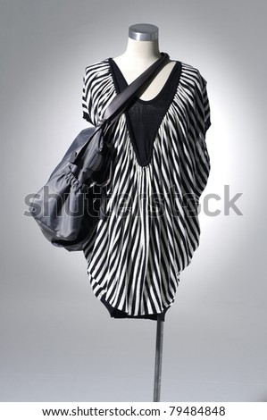 Fashion clothes on a mannequin with bag