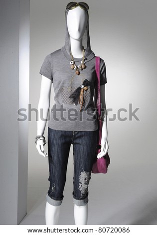 Fashion clothes on a mannequin with handbag