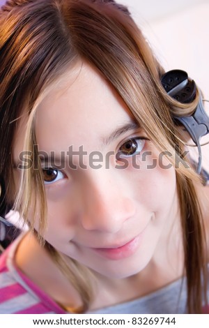 Smiling teenage girl with curling hair clips