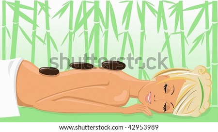 Beautiful young woman enjoying a massage in the spa