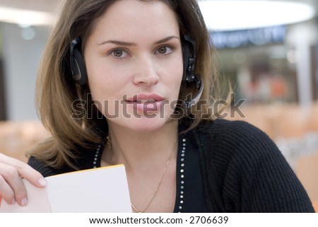 Secretary in call center answering with hands-free