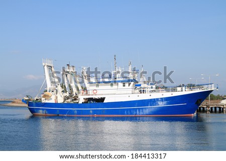 Modern steel fishing ships docked in port
