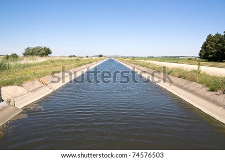 Irrigation channel in the Greek countryside. Diminishing perspective