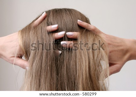 Hands in the long hair