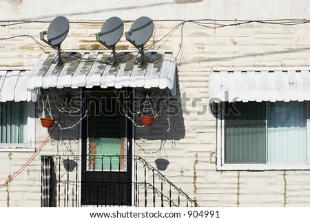 Three Satellite Dishes on a Small Overhang 2