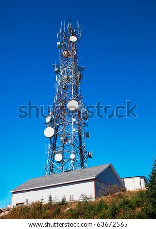 Communication Tower Over a Clear Blue Sky