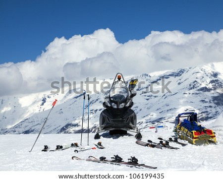 Snowmobile and trailer for transporting injured people in the mountains