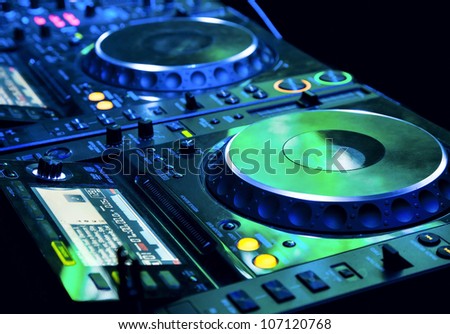DJ CD player and mixer in nightclub