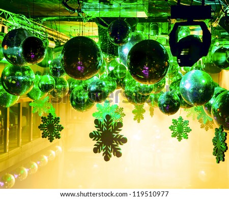 Party lights disco ball at nightclub at Christmas. Bright beautiful rays of light