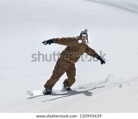 Free rider snowboarder moving down in snow powder
