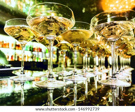Glasses Of Champagne At The Bar In Festive Evening. Soft Focus
