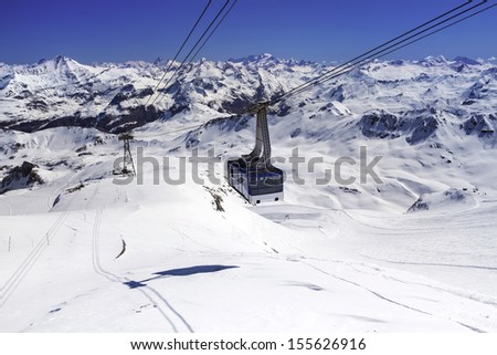 Cableway to transport large numbers of people high in mountains of French Alps
