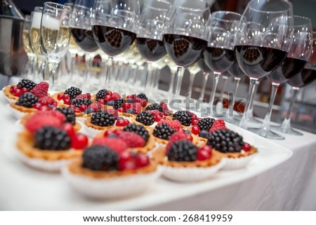 Festive buffet at the event with desert, champagne and wine. Soft focus