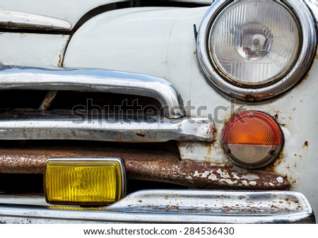 MOSCOW, RUSSIA - 16 AUG: Front view of an old car closeup. Soviet retro car GAZ-M20 Pobeda (Victory) is the biggest retro car on August 16, 2014 in Moscow, Russia.
