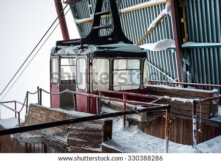 Old pendulum cableway for transport large numbers of people, standing at the station in mountains Caucasus